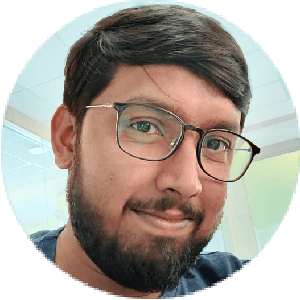 Smiling man with spectacles in the audience